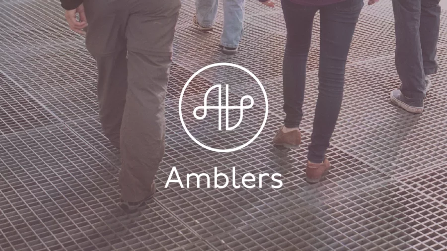Photograph of legs walking on grate, overlaid with Amblers logo.